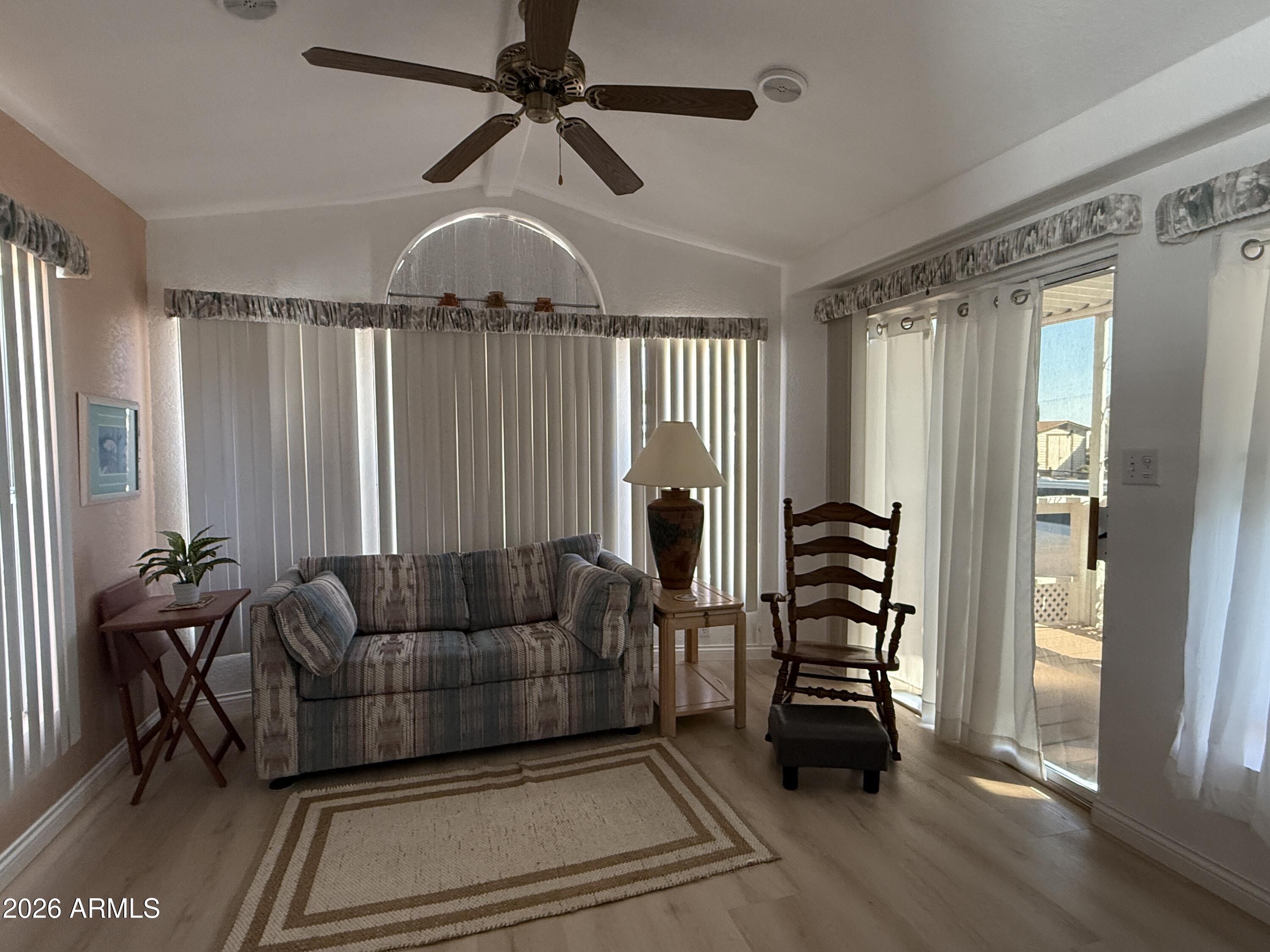21340 Trading Post Trail Congress, AZ 85332 - Photo 3 of 31 a living room with furniture and a chandelier