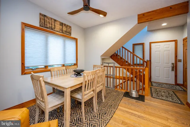 a view of a dining room with furniture window and wooden floor