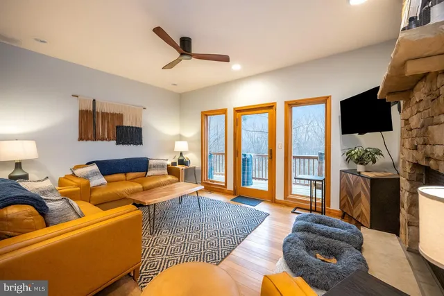 a living room with furniture and a flat screen tv