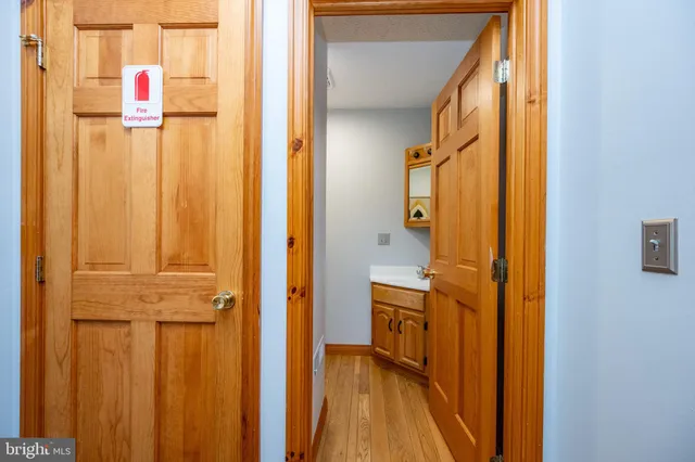a view of a bathroom with a shower and a sink