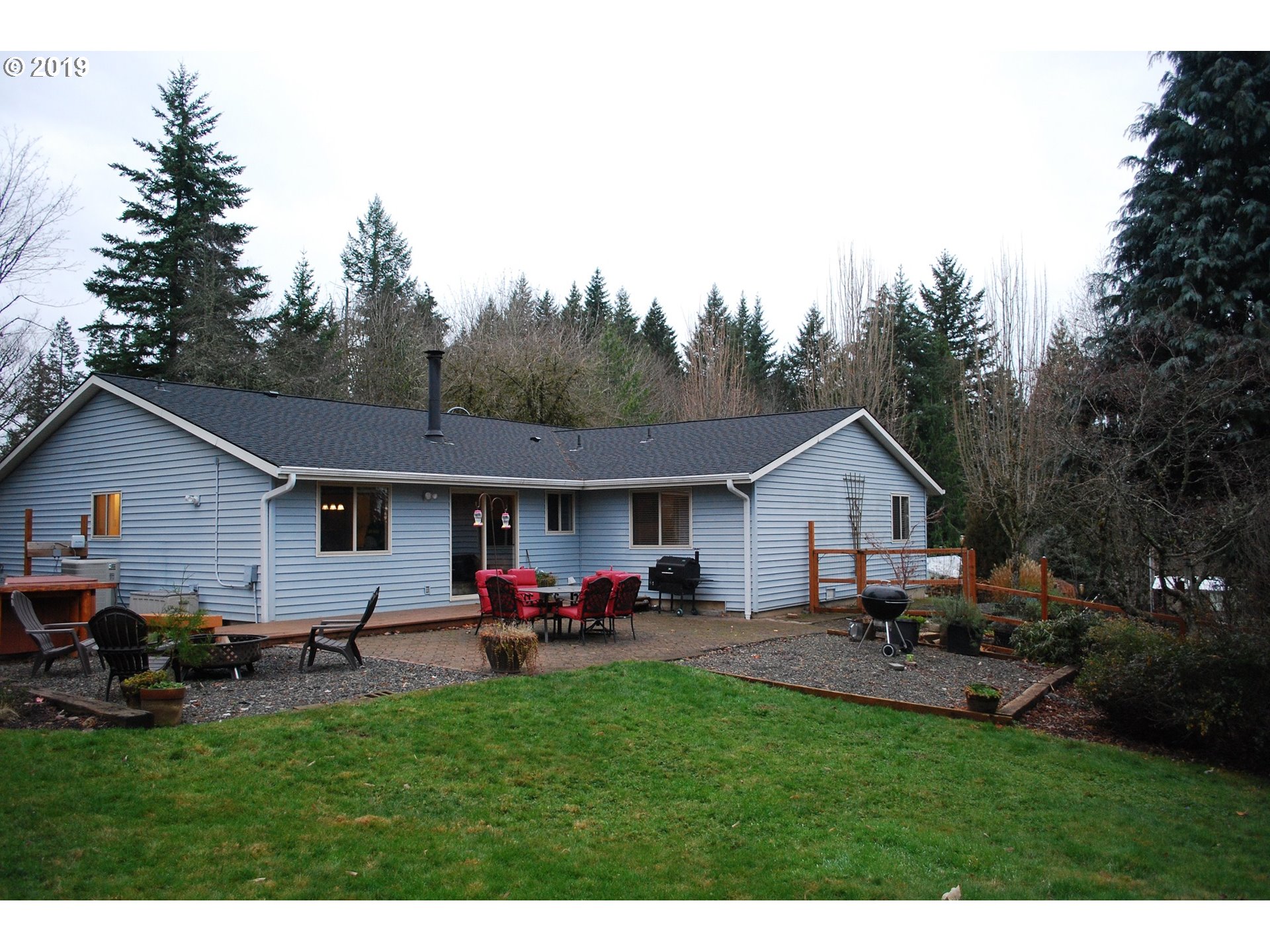 a view of a backyard of the house