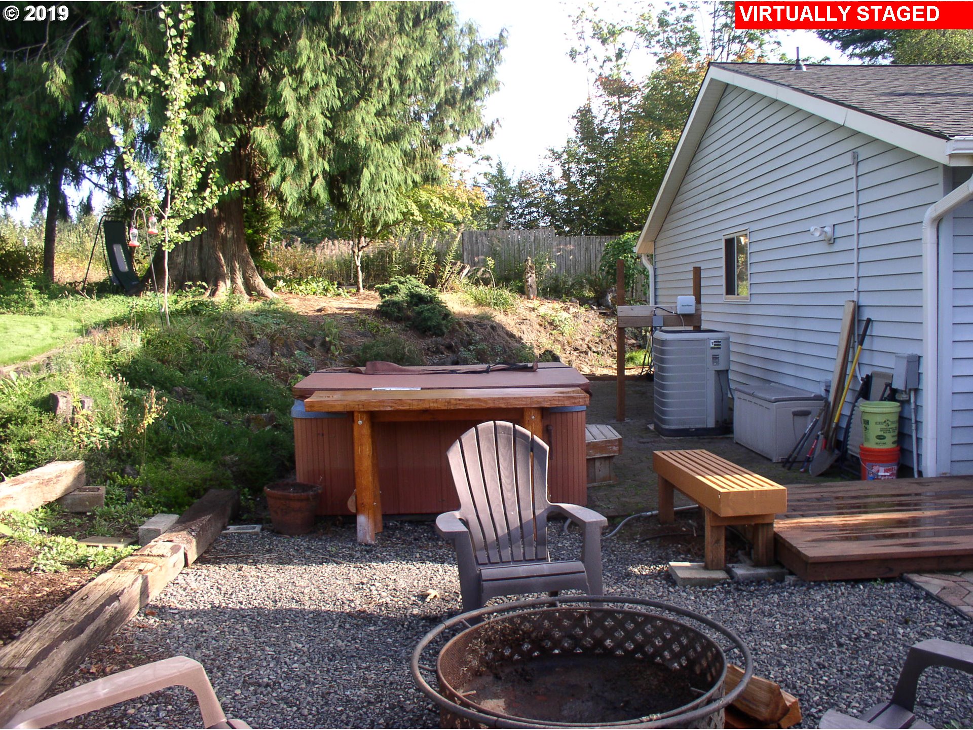 39586 Southeast Trubel Road Sandy, OR 97055 - Photo 17 of 28 a view of a patio with table and chairs with a barbeque grill and plants