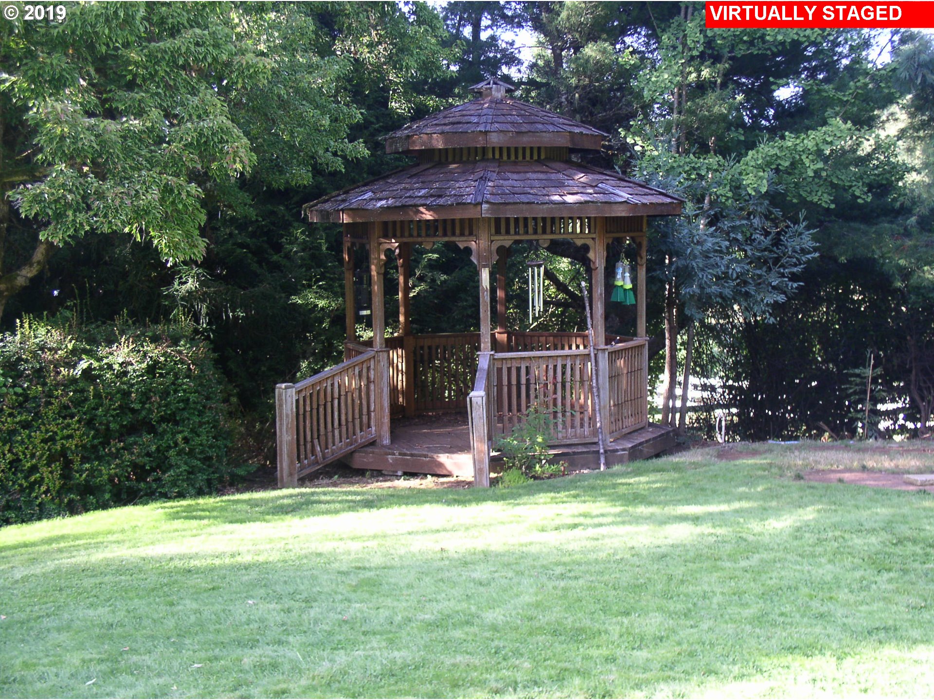 39586 Southeast Trubel Road Sandy, OR 97055 - Photo 18 of 28 a front view of a house with a garden and trees