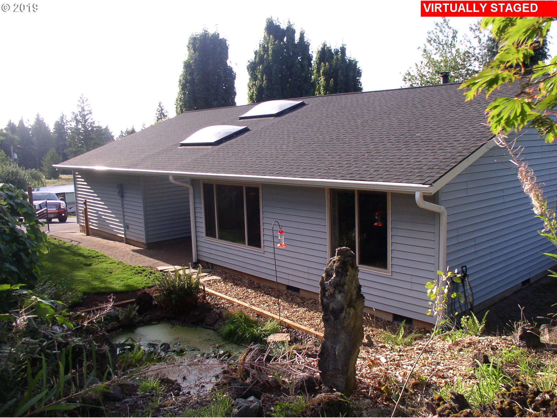 39586 Southeast Trubel Road Sandy, OR 97055 - Photo 2 of 28 a front view of a house with garden