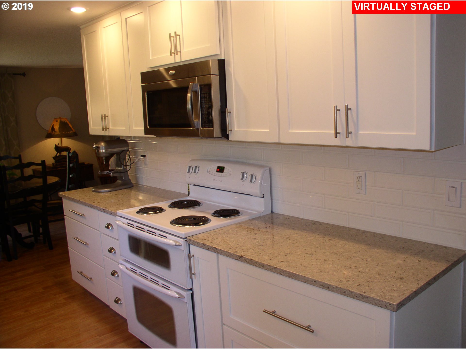 39586 Southeast Trubel Road Sandy, OR 97055 - Photo 5 of 28 a kitchen with stainless steel appliances granite countertop a stove a sink and a microwave