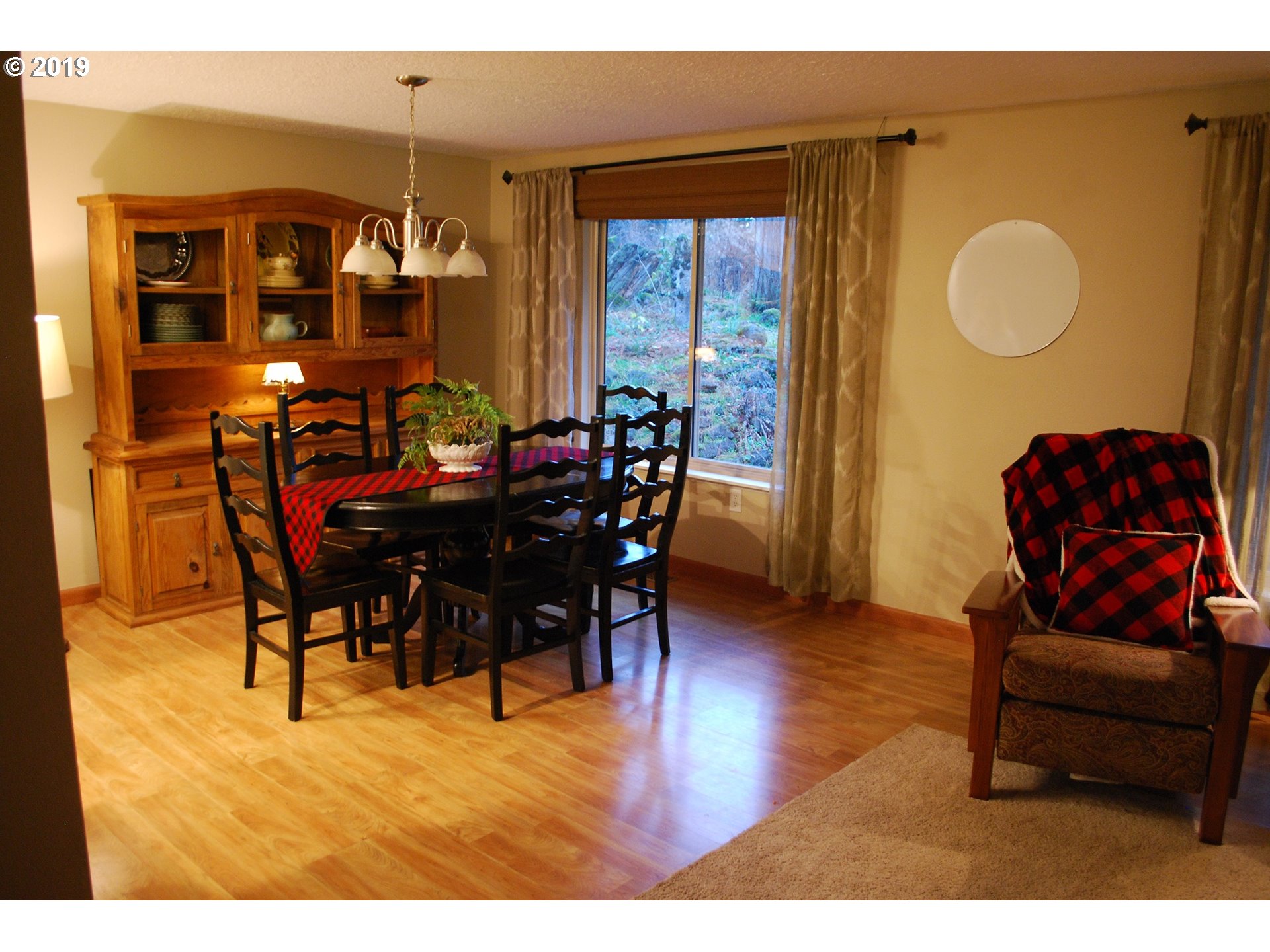 39586 Southeast Trubel Road Sandy, OR 97055 - Photo 10 of 28 a view of a dining room with furniture and wooden floor