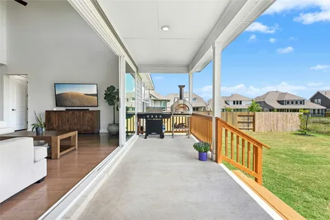 a view of a living room and a balcony