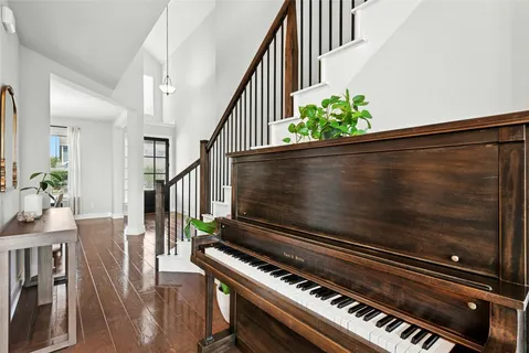 a view of an entryway with wooden floor