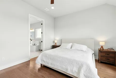 a bedroom with a bed and a view of livingroom