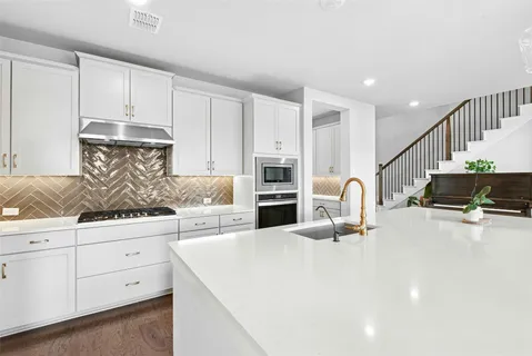 a kitchen with counter top space and cabinets