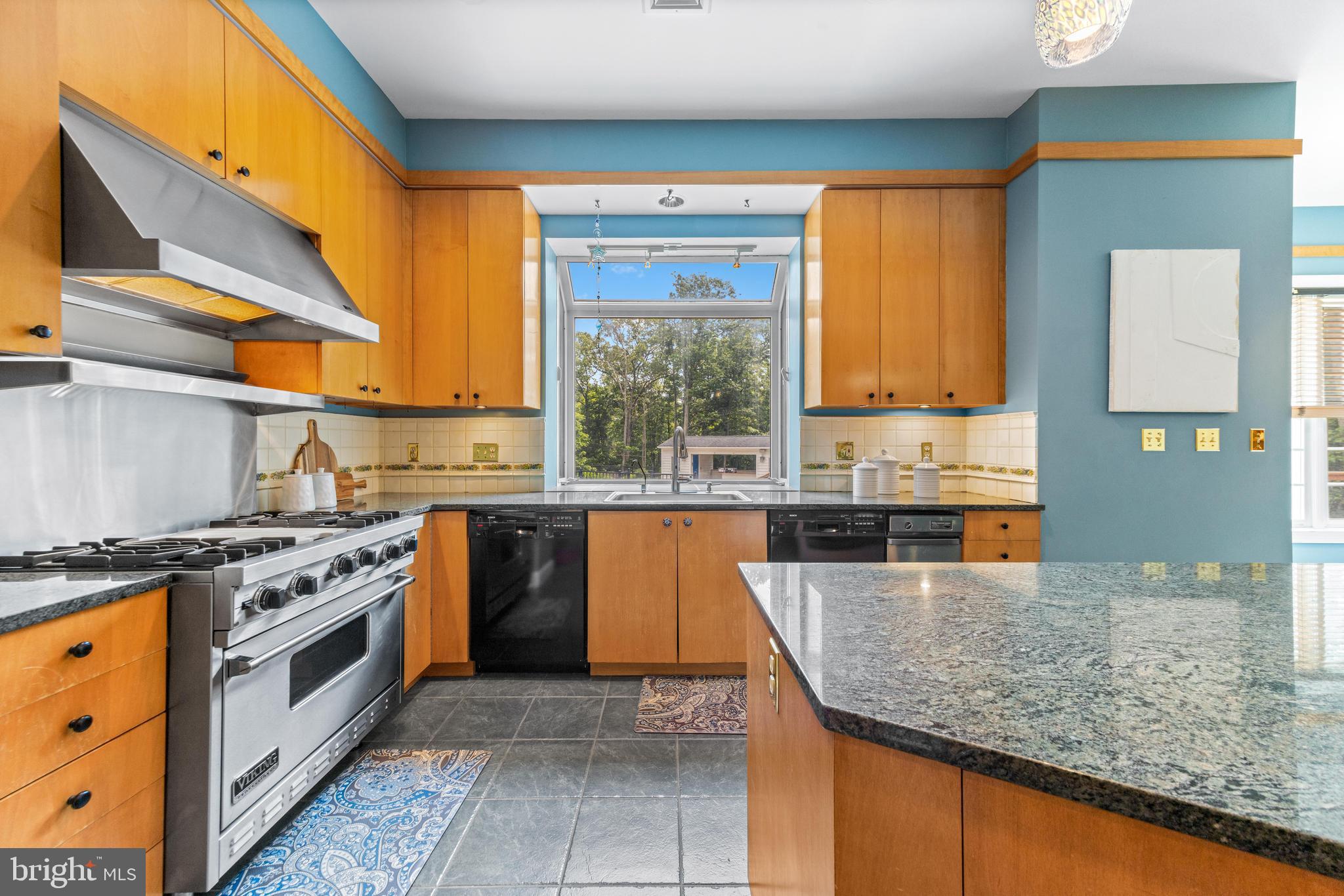 4120 Piney Grove Road Glyndon, MD 21136 - Photo 15 of 42 a kitchen with stainless steel appliances granite countertop a stove a sink and a microwave