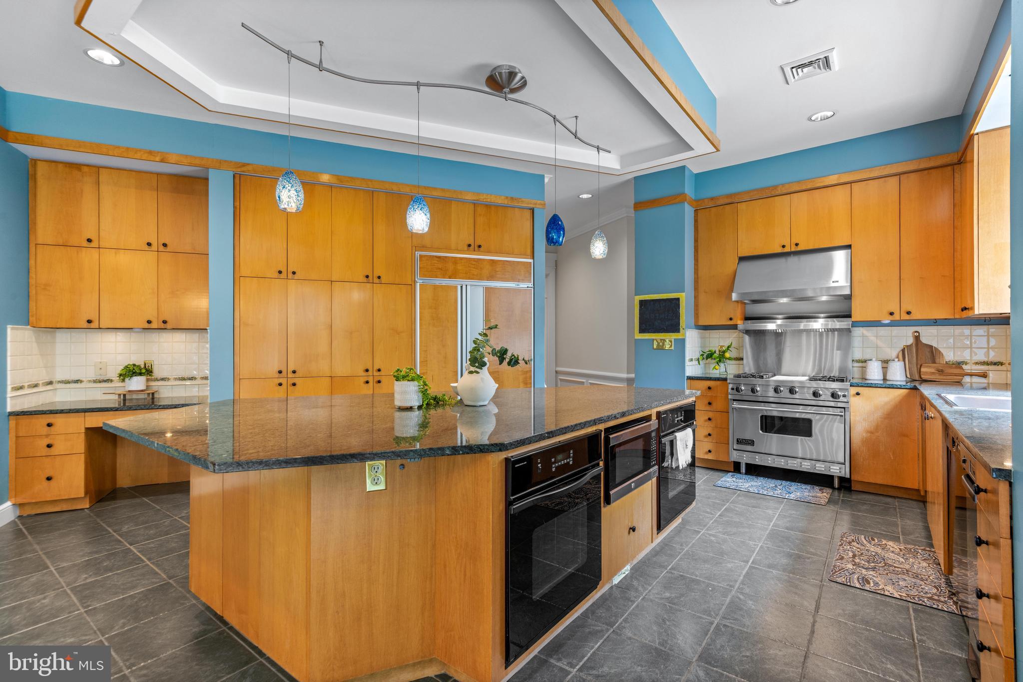4120 Piney Grove Road Glyndon, MD 21136 - Photo 16 of 42 a large kitchen with stainless steel appliances granite countertop a stove and cabinets