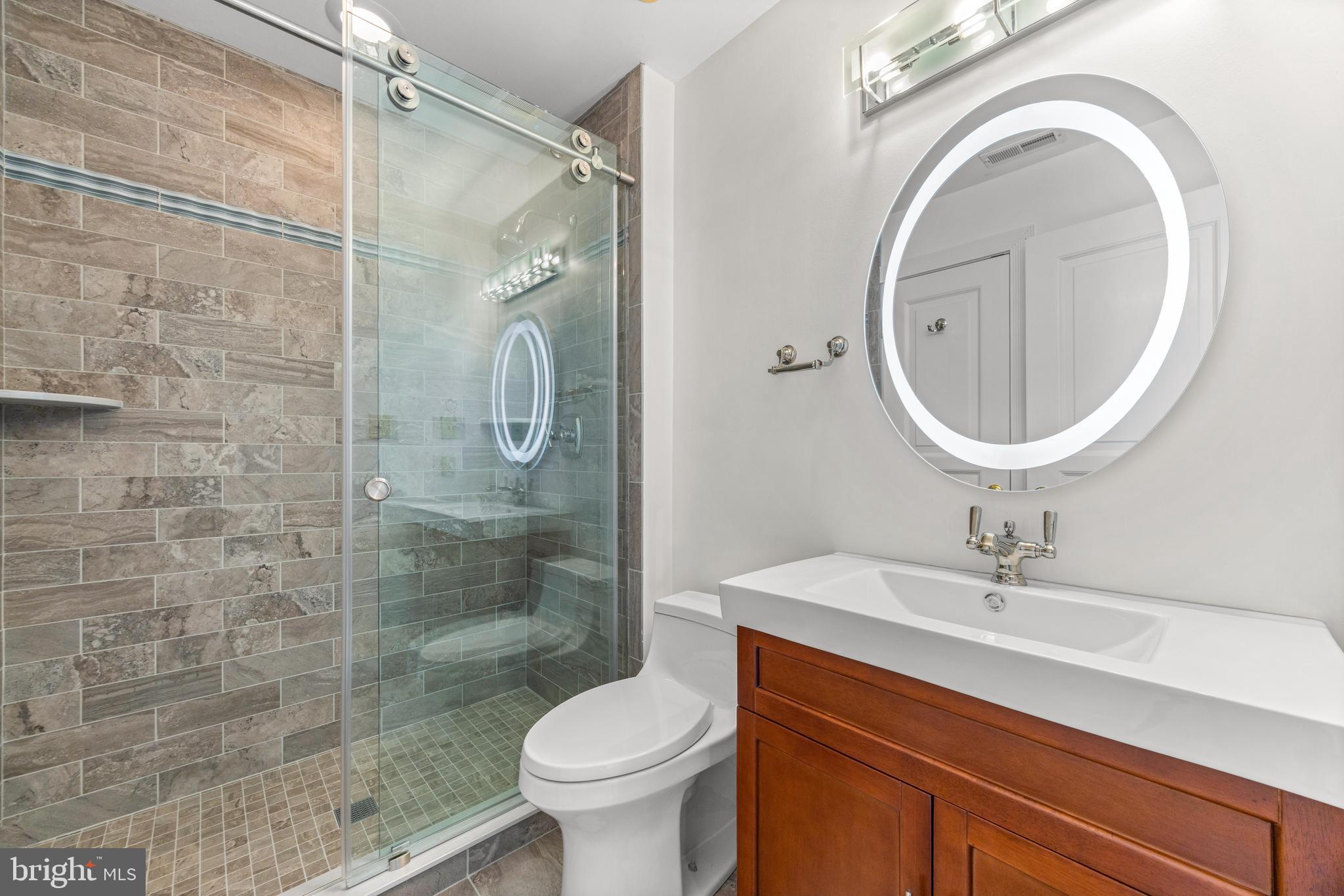 4120 Piney Grove Road Glyndon, MD 21136 - Photo 20 of 42 a bathroom with a sink a toilet and a mirror