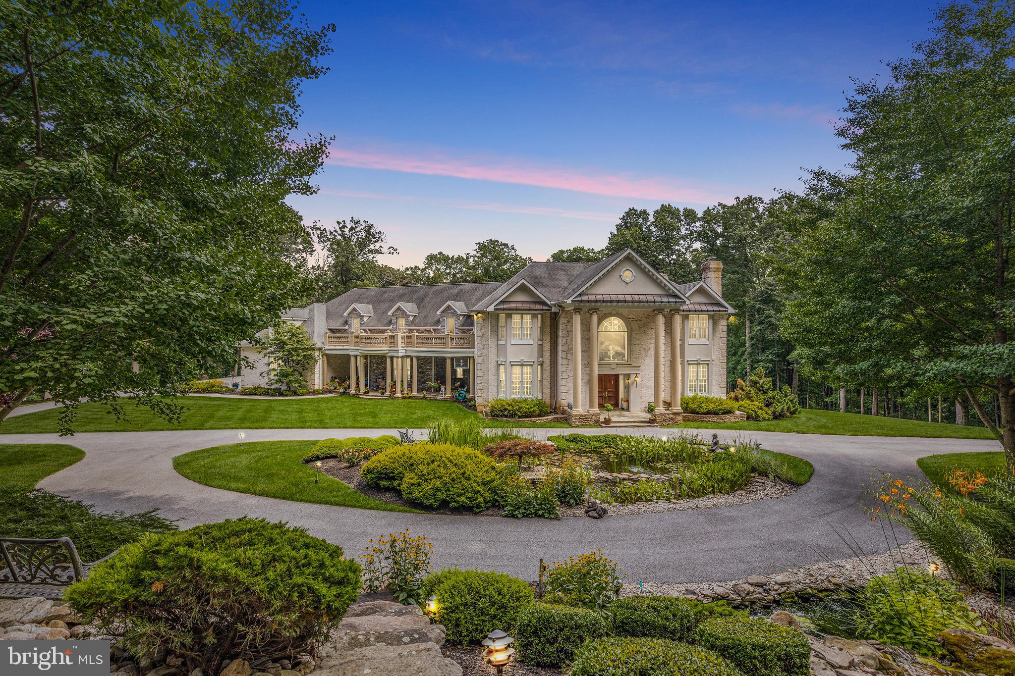 4120 Piney Grove Road Glyndon, MD 21136 - Photo 2 of 42 a front view of a house with a garden
