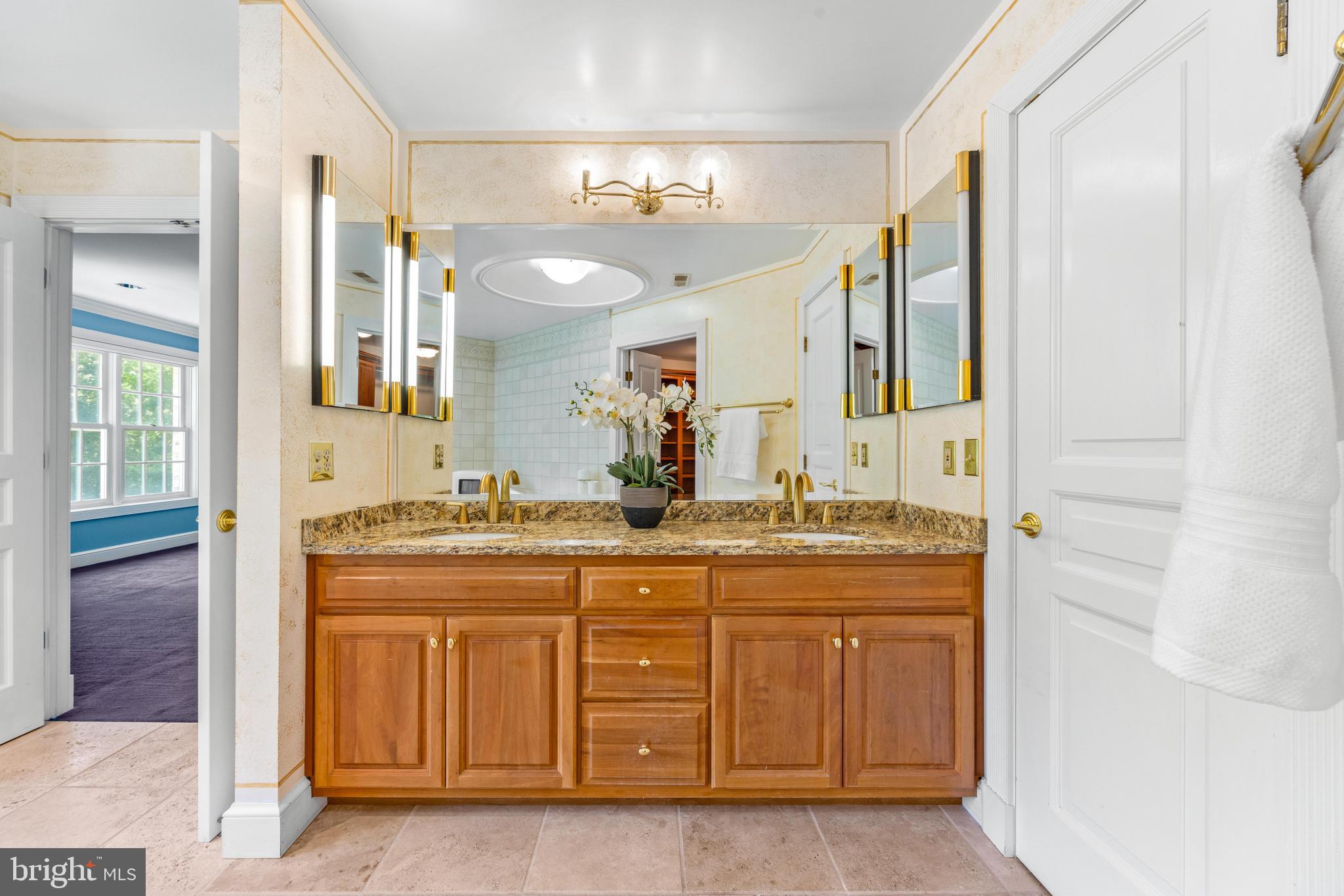 4120 Piney Grove Road Glyndon, MD 21136 - Photo 22 of 42 a bathroom with a granite countertop sink a mirror and a
