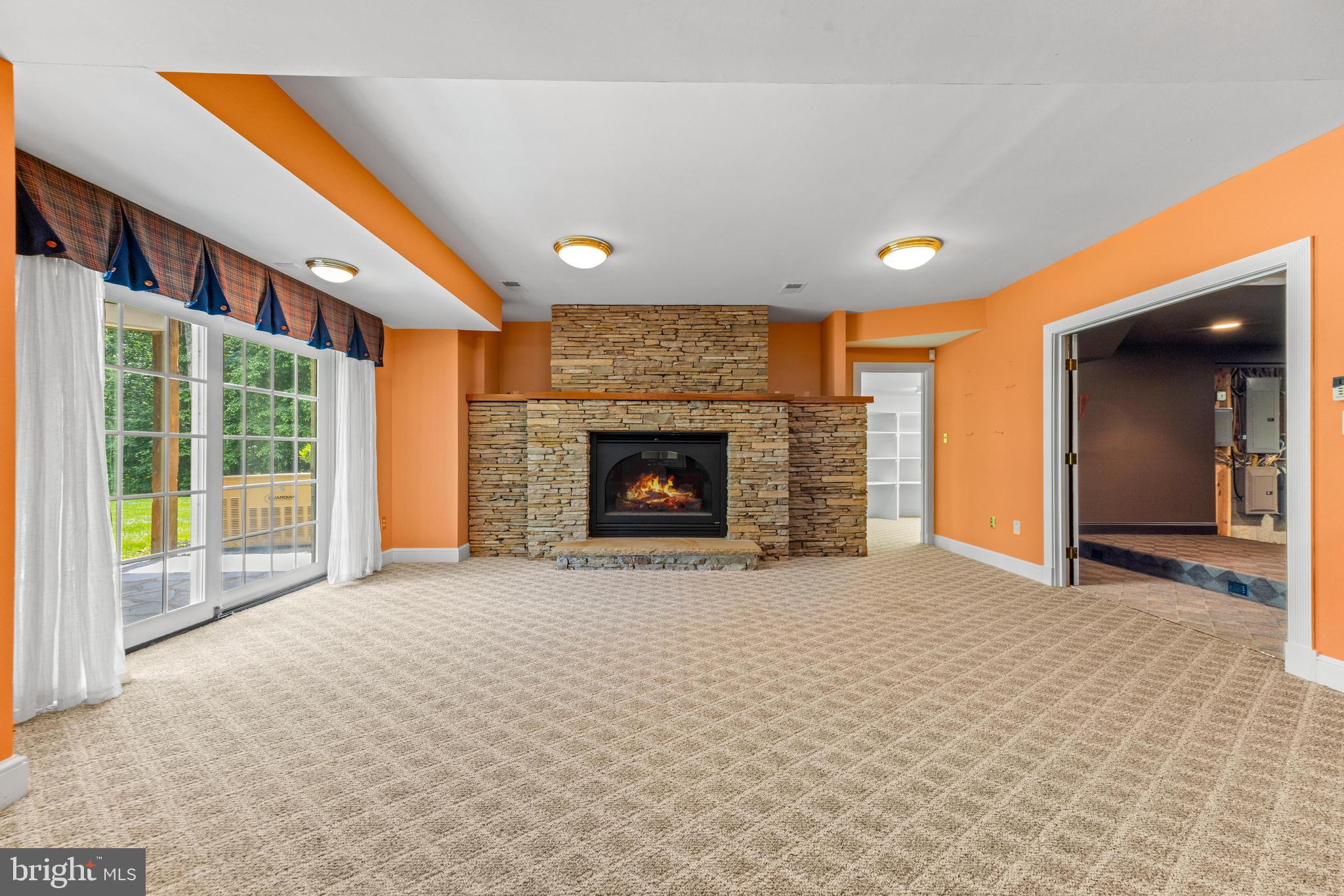 4120 Piney Grove Road Glyndon, MD 21136 - Photo 29 of 42 a view of an empty room with a fireplace and a window
