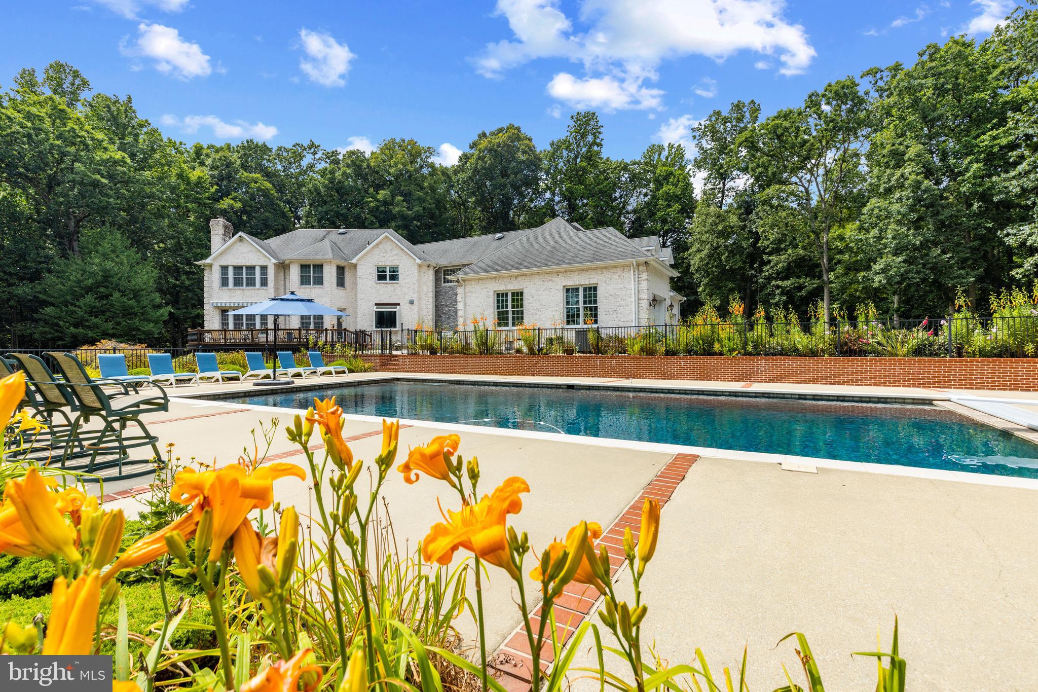 4120 Piney Grove Road Glyndon, MD 21136 - Photo 32 of 42 a view of swimming pool with a garden and trees