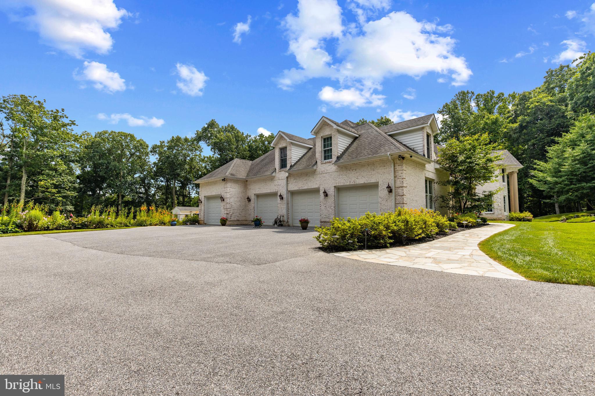 4120 Piney Grove Road Glyndon, MD 21136 - Photo 35 of 42 a view of a house with a backyard and a garden