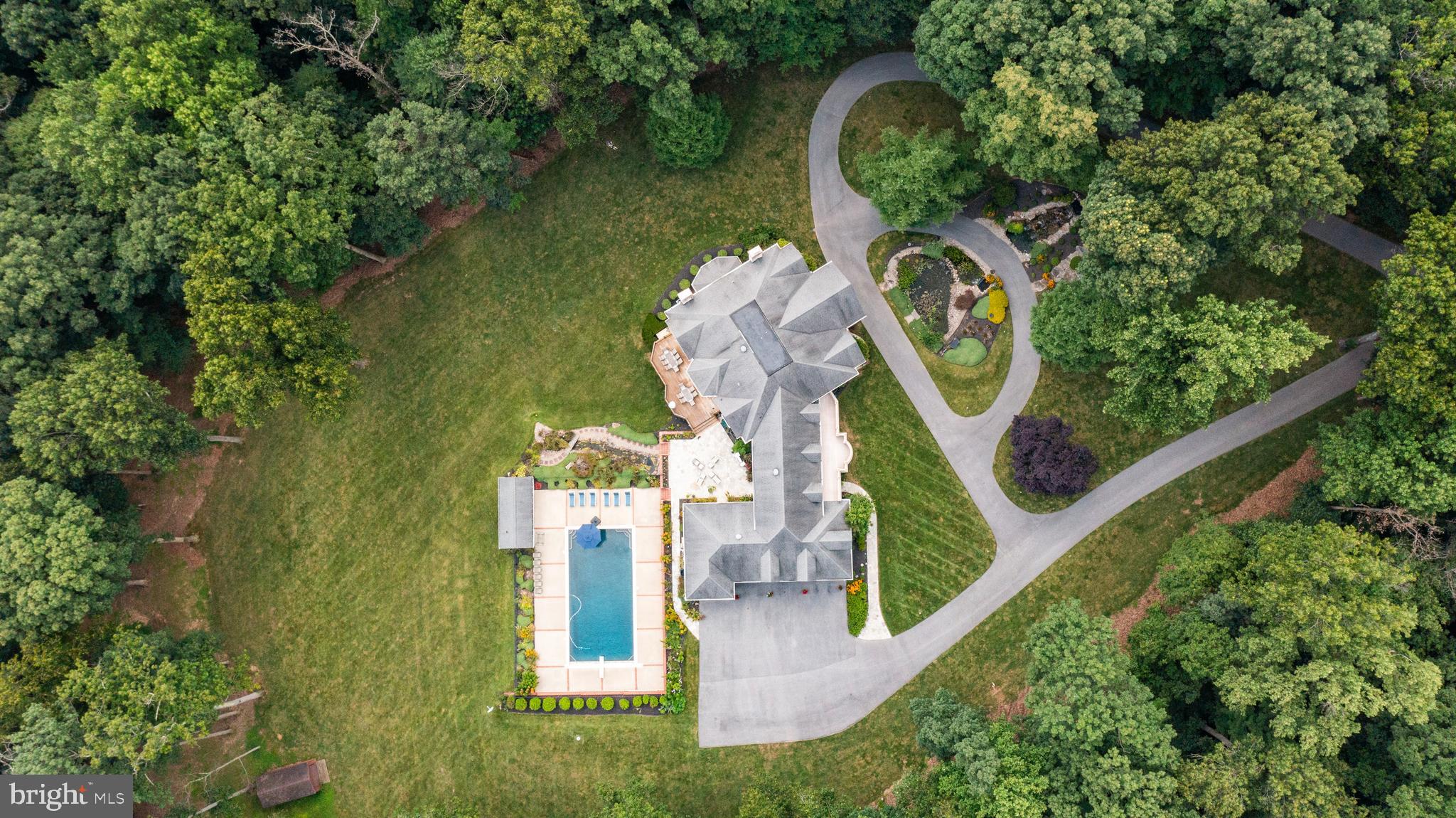 4120 Piney Grove Road Glyndon, MD 21136 - Photo 39 of 42 an aerial view of a house with swimming pool and outdoor seating