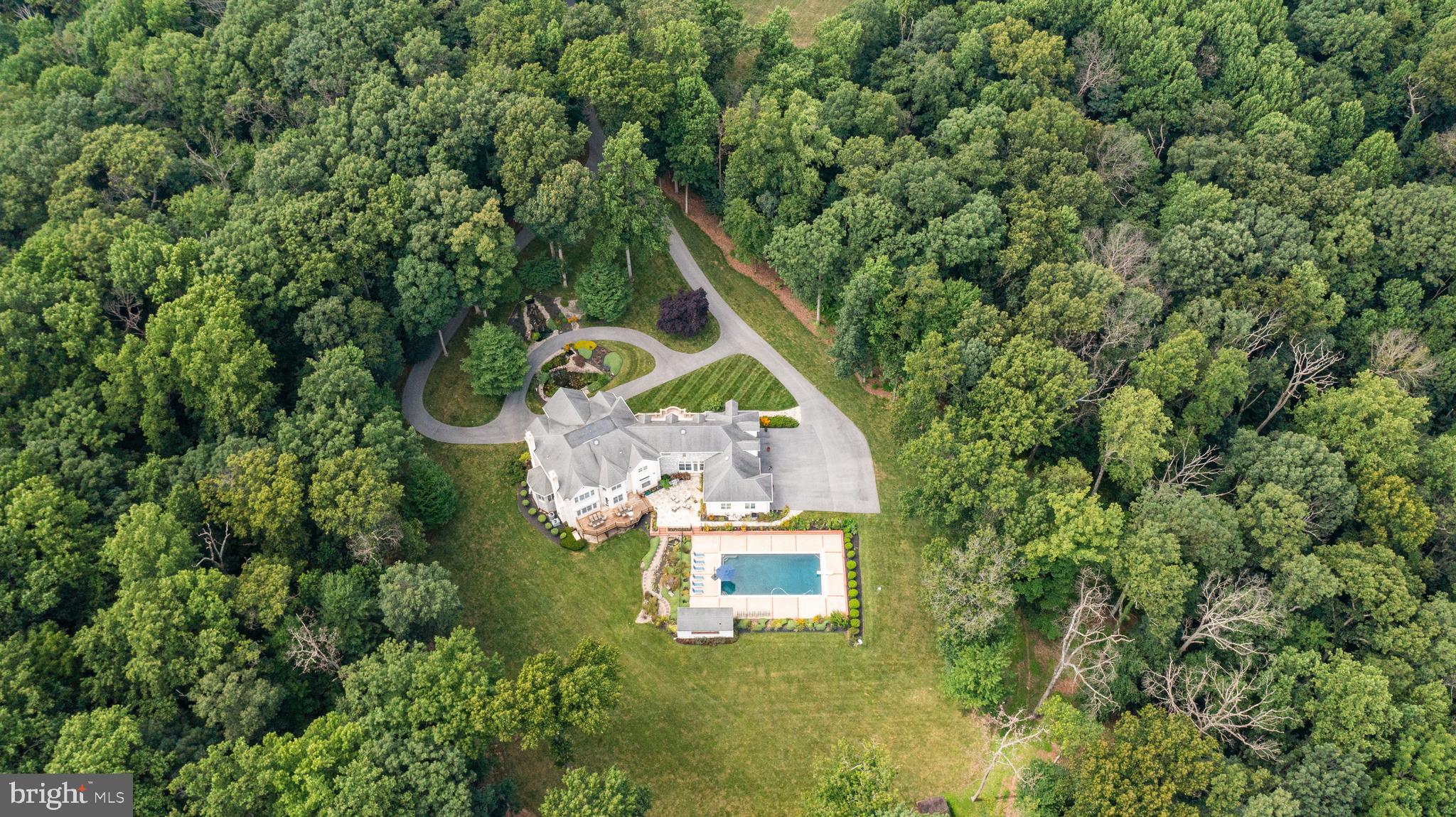 4120 Piney Grove Road Glyndon, MD 21136 - Photo 40 of 42 an aerial view of a house with swimming pool outdoor seating and yard