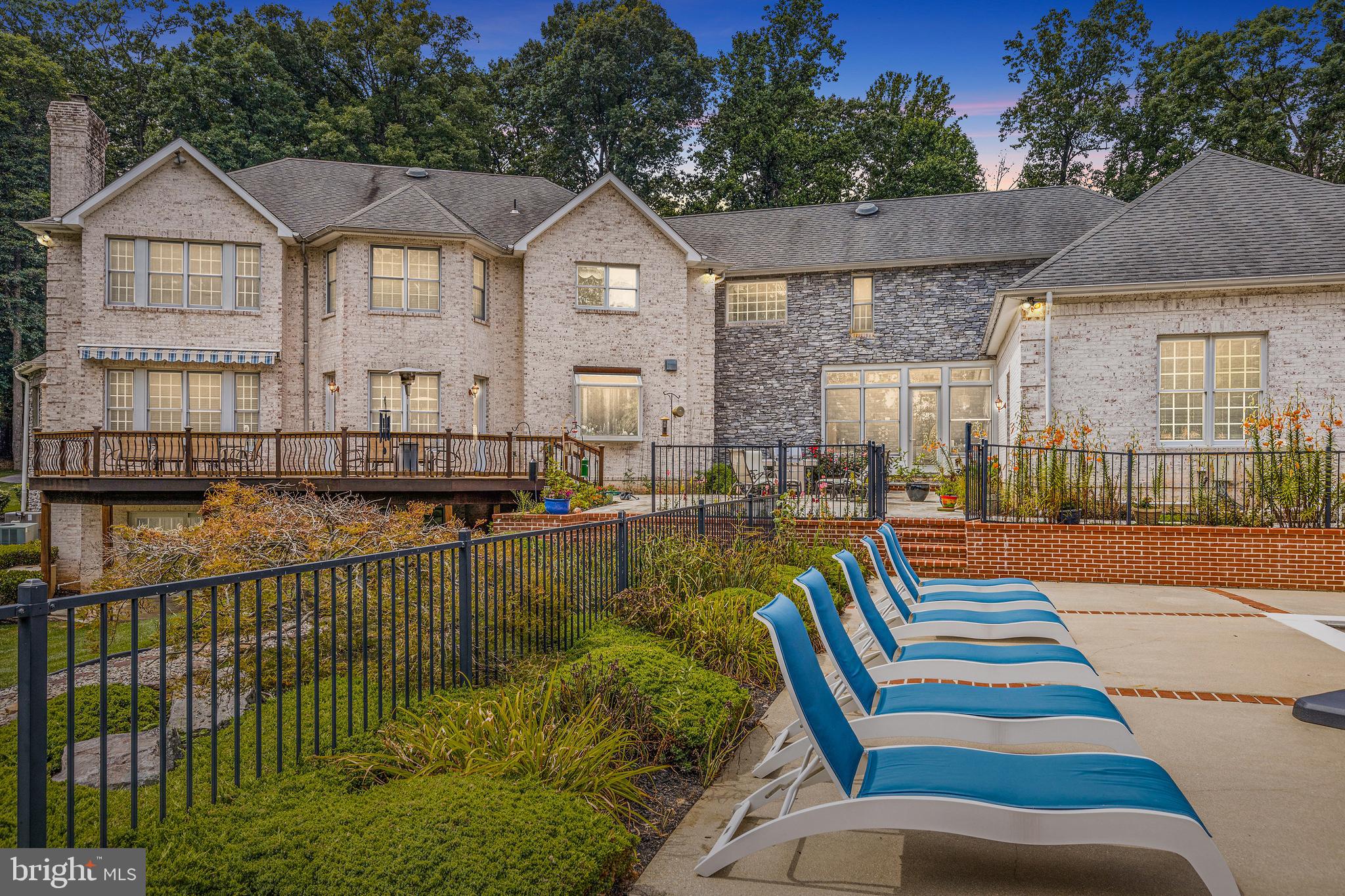 4120 Piney Grove Road Glyndon, MD 21136 - Photo 42 of 42 a front view of a house with a yard table and chairs