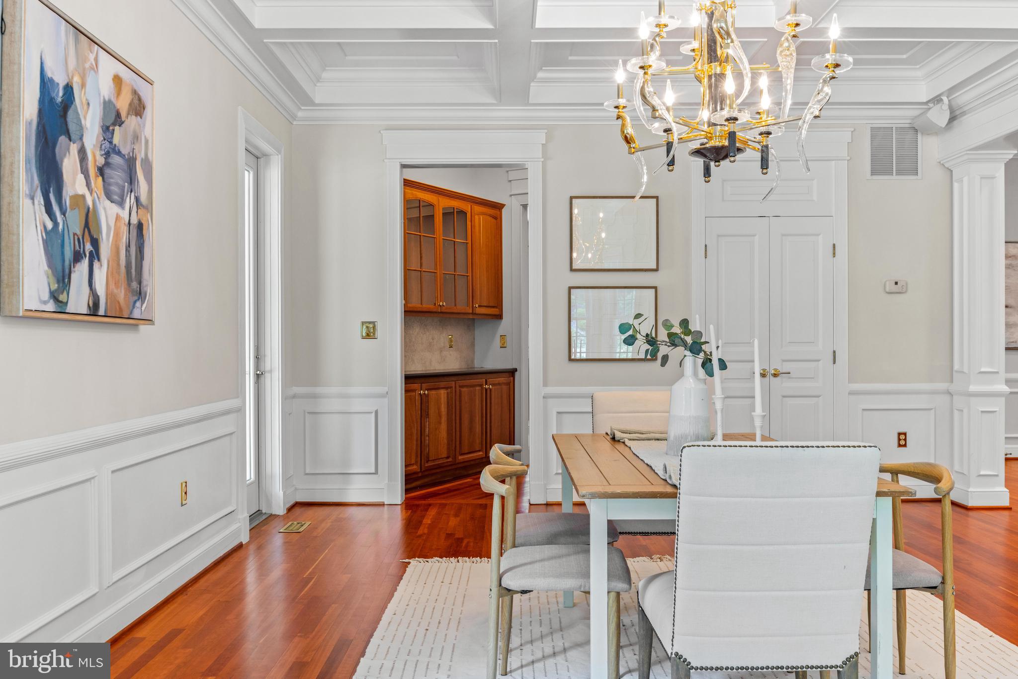 4120 Piney Grove Road Glyndon, MD 21136 - Photo 10 of 42 a dining room with wooden floor and chandelier