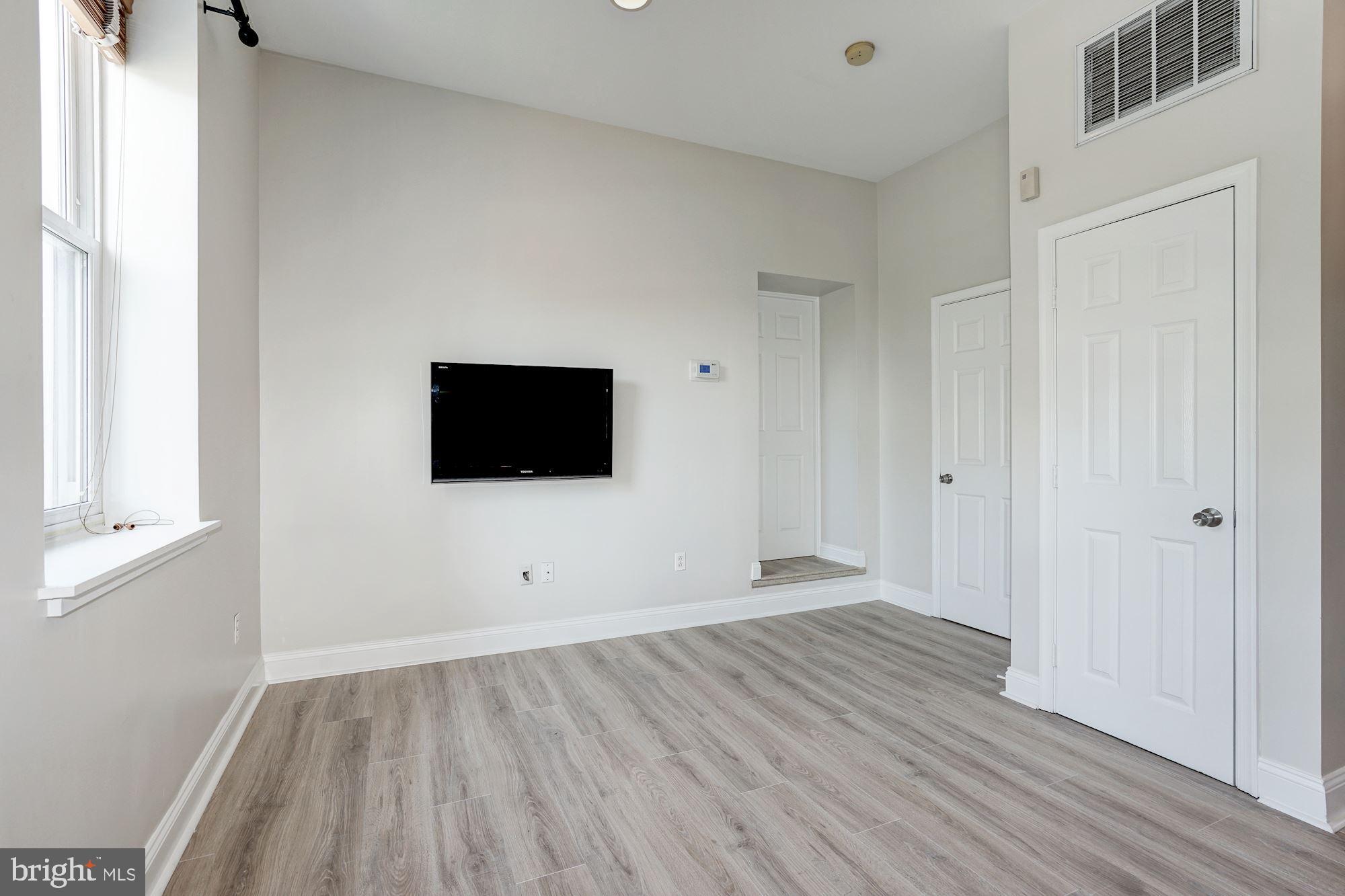 1124 E Street Northeast, Unit C Washington, DC 20002 - Photo 18 of 29 Step up into the master bedroom