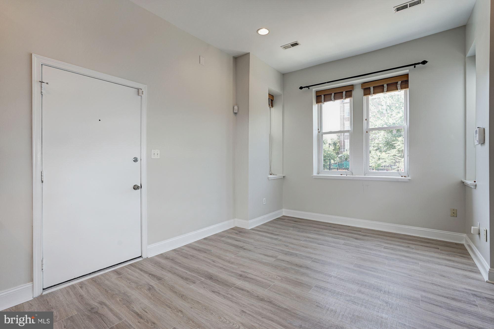 1124 E Street Northeast, Unit C Washington, DC 20002 - Photo 4 of 29 Tons of light greets you on entering this home