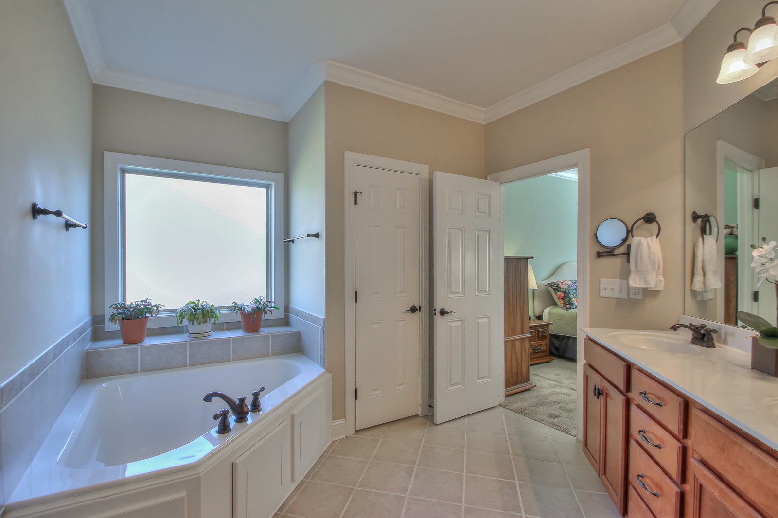 3028 Sakari Circle Spring Hill, TN 37174 - Photo 27 of 46 a spacious bathroom with a tub sink and mirror
