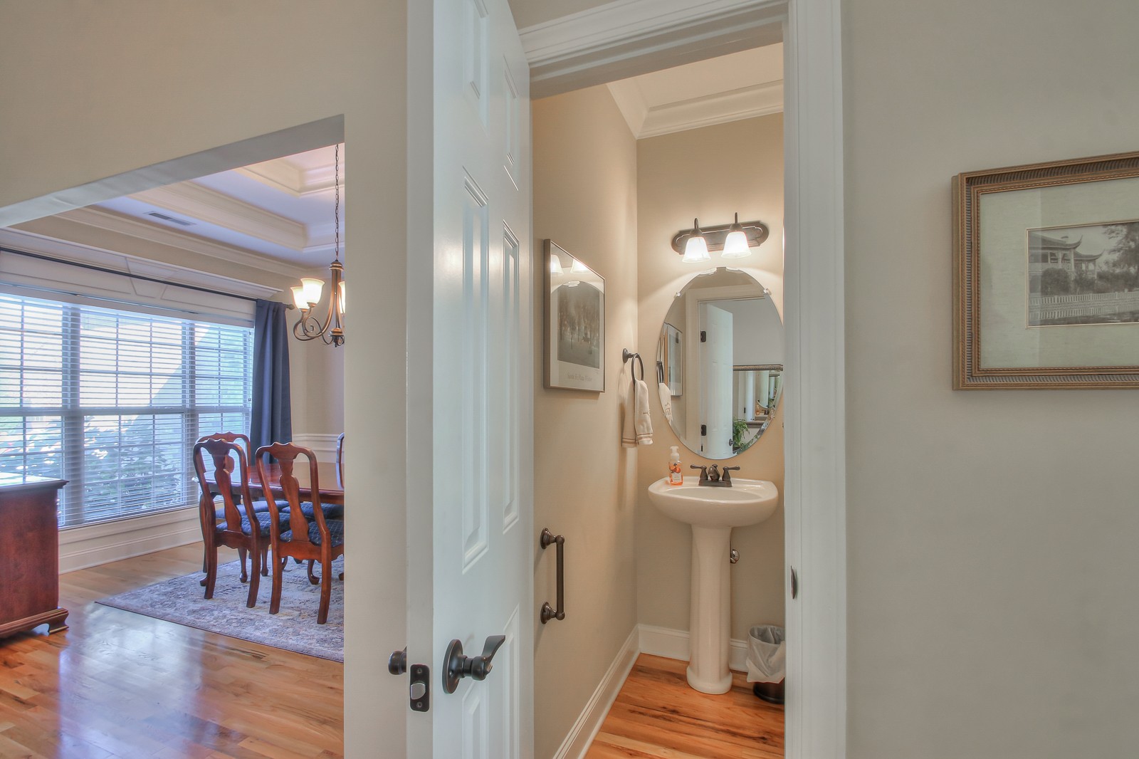 3028 Sakari Circle Spring Hill, TN 37174 - Photo 6 of 46 a view of a hallway with wooden floor and dining room