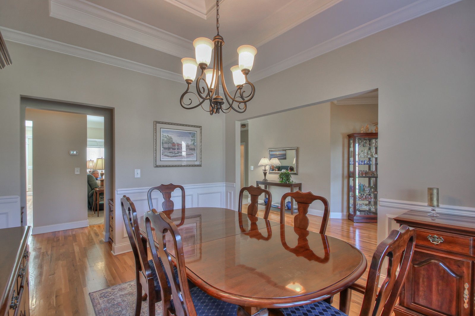 3028 Sakari Circle Spring Hill, TN 37174 - Photo 9 of 46 a view of a dining room with furniture a chandelier and wooden floor