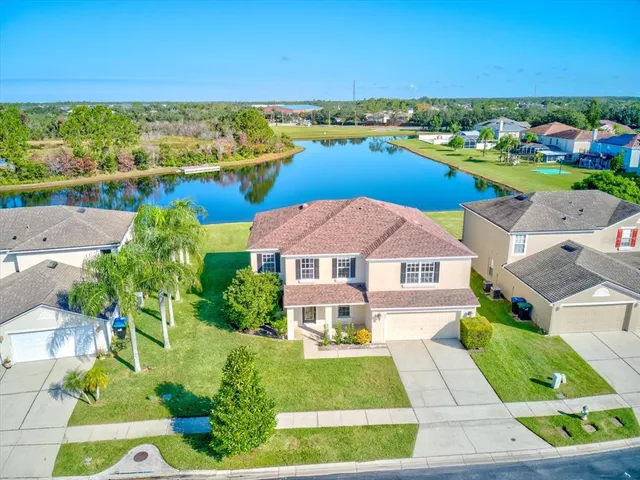 an aerial view of a house with a ocean view
