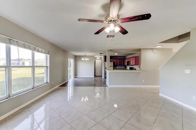 a large kitchen with stainless steel appliances granite countertop a stove and a sink
