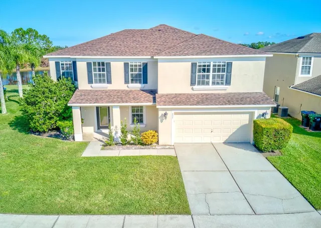 a front view of a house with a yard