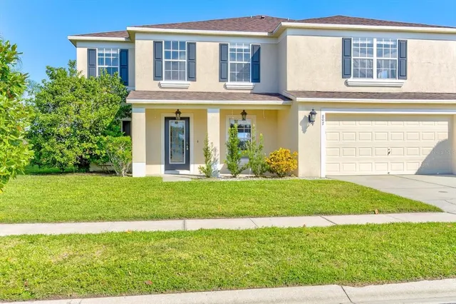 an aerial view of a house with a garden