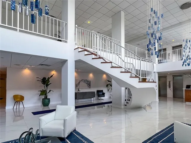 a view of entryway and hall with dining room