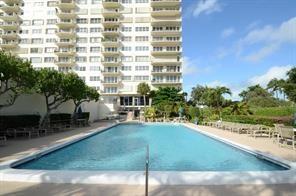 2500 East Las Olas Boulevard, Unit 308 Fort Lauderdale, FL 33301 - Photo 21 of 26 a view of a patio with a table and chairs and potted plants