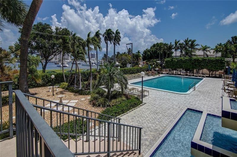 2500 East Las Olas Boulevard, Unit 308 Fort Lauderdale, FL 33301 - Photo 22 of 26 a view of a balcony with swimming pool and outdoor seating