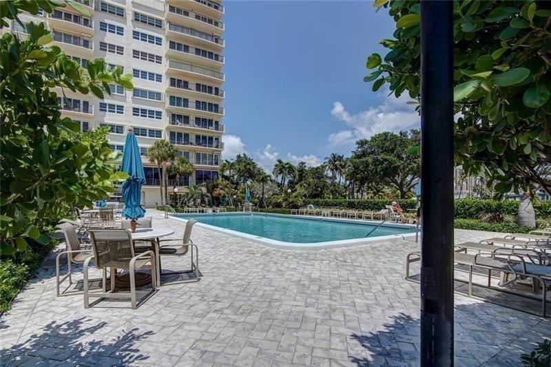 2500 East Las Olas Boulevard, Unit 308 Fort Lauderdale, FL 33301 - Photo 24 of 26 a view of a patio with a table and chairs