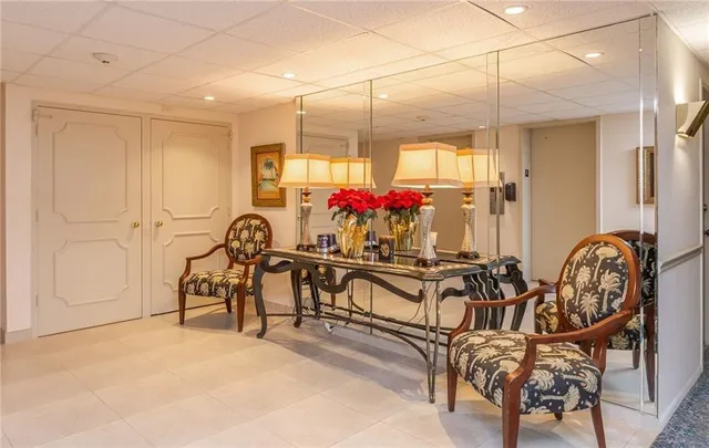 a view of a chairs and tables in a room