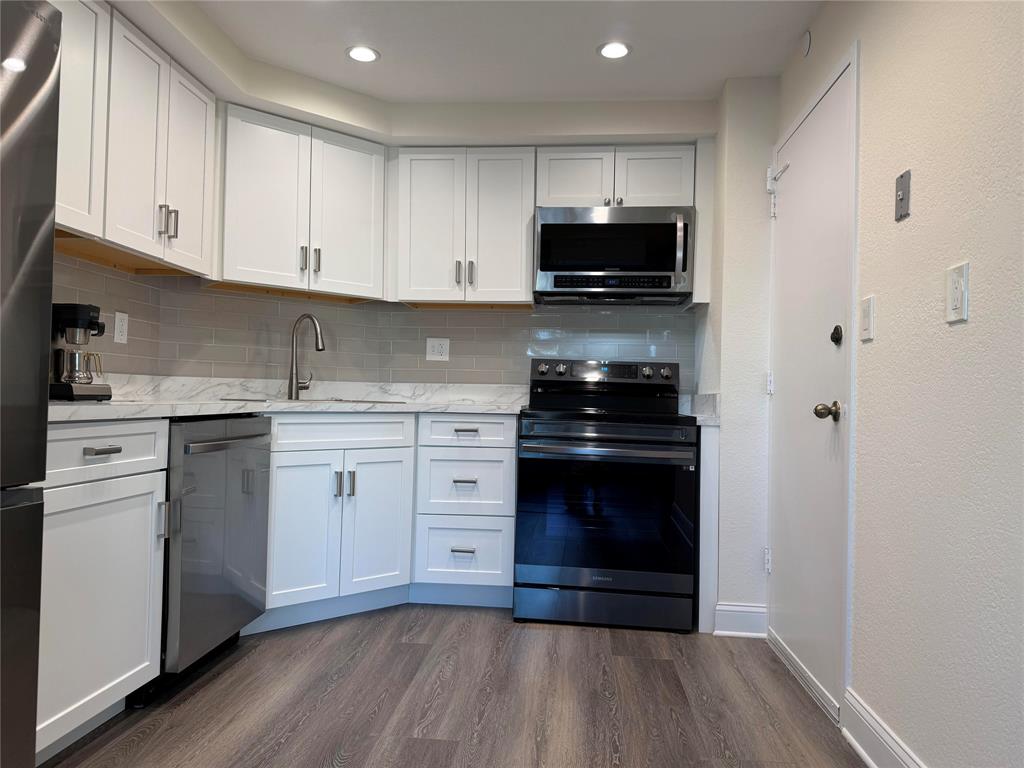 2500 East Las Olas Boulevard, Unit 308 Fort Lauderdale, FL 33301 - Photo 5 of 26 a kitchen with a sink stove and cabinets