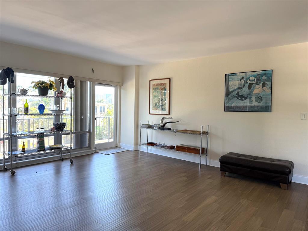 2500 East Las Olas Boulevard, Unit 308 Fort Lauderdale, FL 33301 - Photo 6 of 26 a view of a livingroom with furniture wooden floor and windows