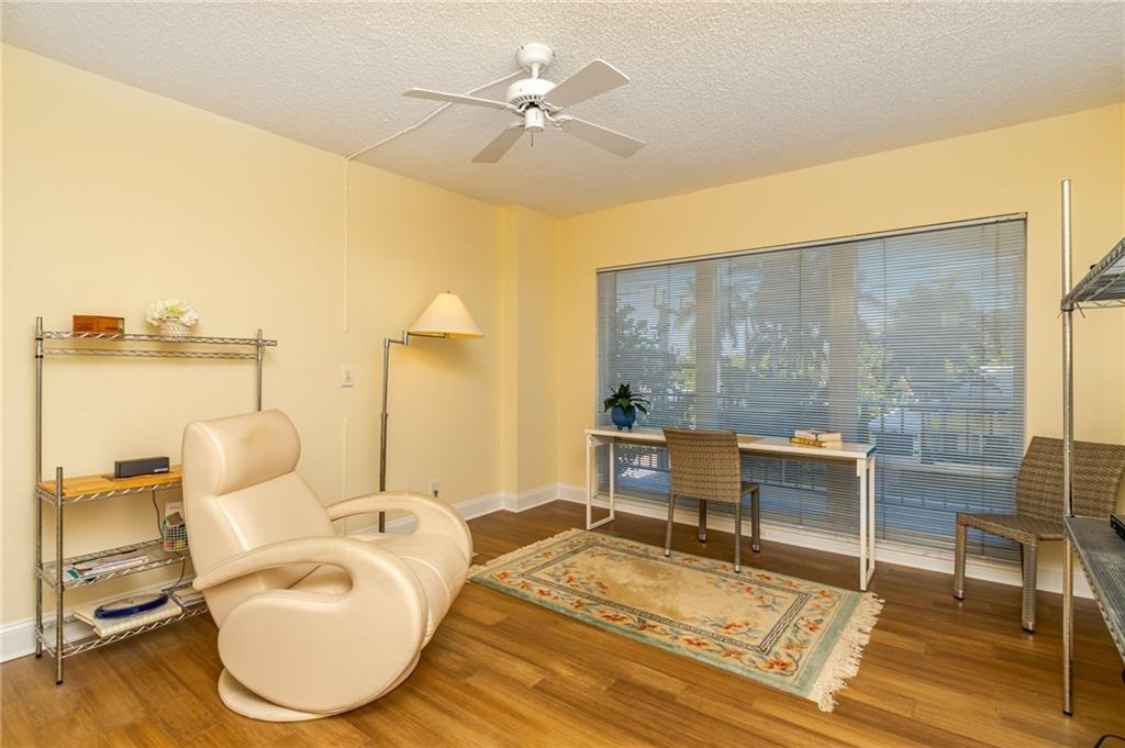 2500 East Las Olas Boulevard, Unit 308 Fort Lauderdale, FL 33301 - Photo 7 of 26 a living room with furniture and a table