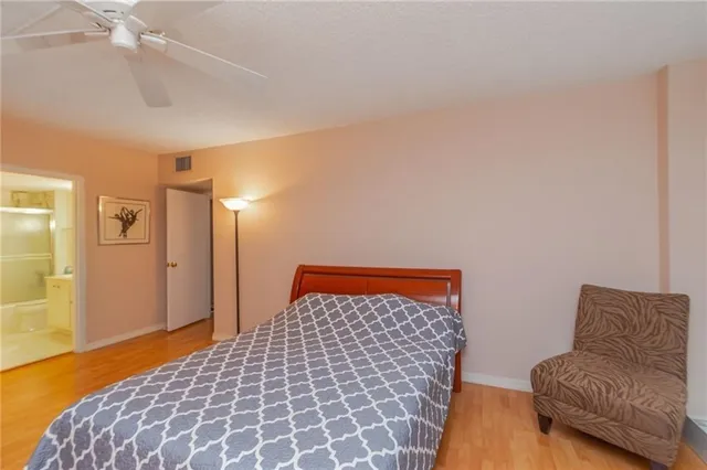 a bedroom with a bed and a couch