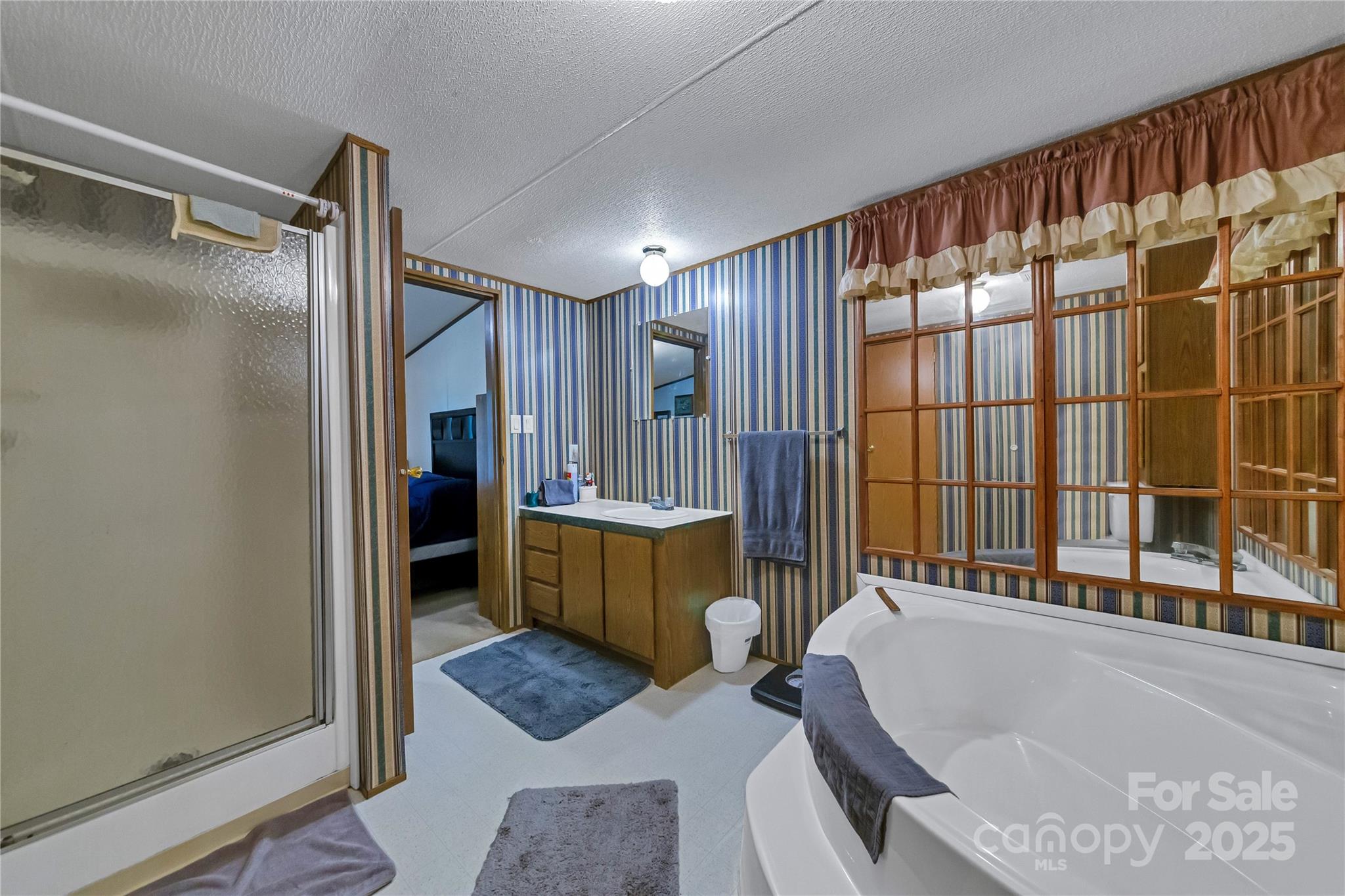 43 Goose Creek Road Swannanoa, NC 28778 - Photo 12 of 25 a bathroom with a tub and a shower