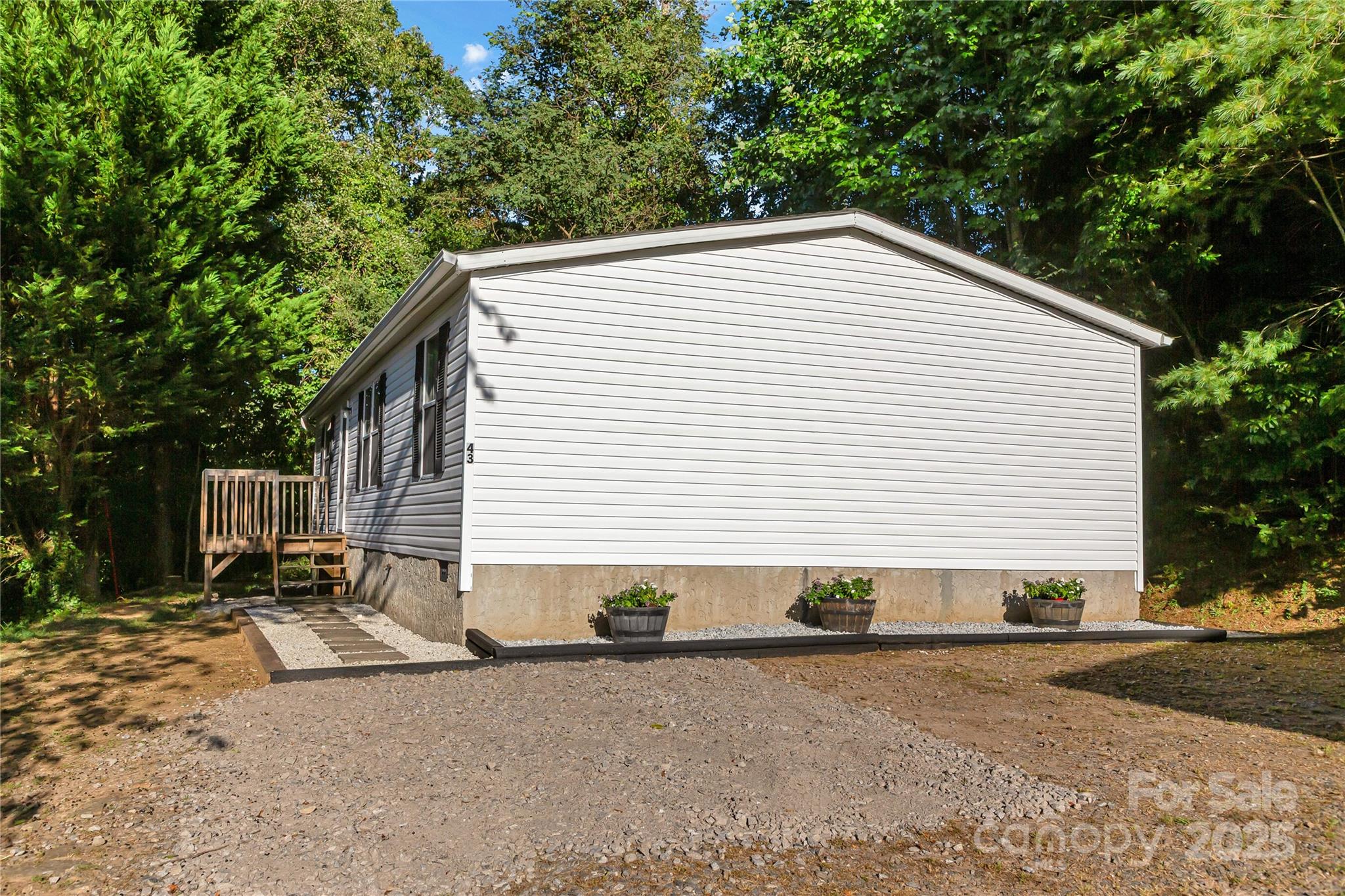 43 Goose Creek Road Swannanoa, NC 28778 - Photo 20 of 25 a view of a house with a yard and garage