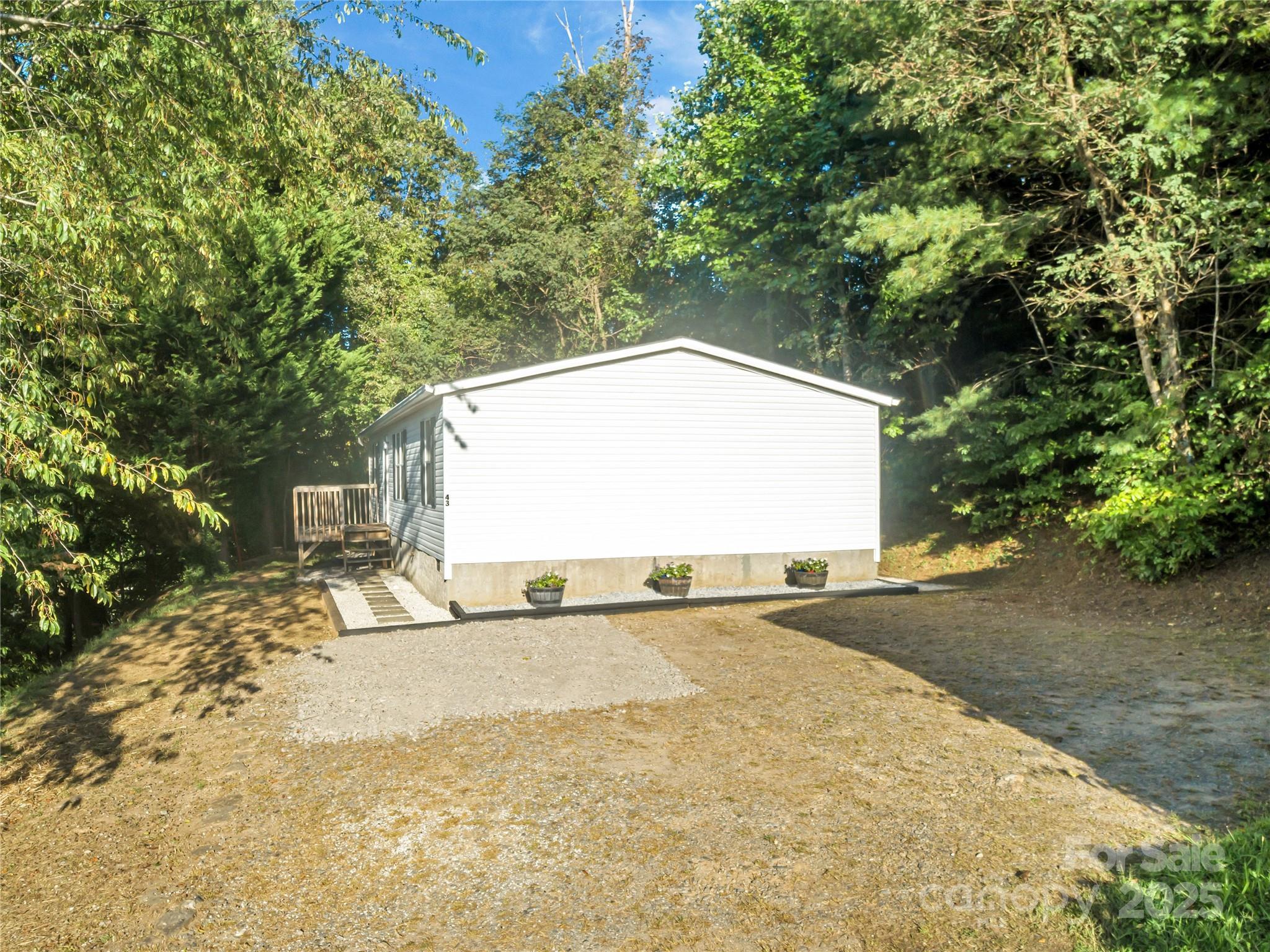 43 Goose Creek Road Swannanoa, NC 28778 - Photo 2 of 25 a view of a outdoor space with a house and trees