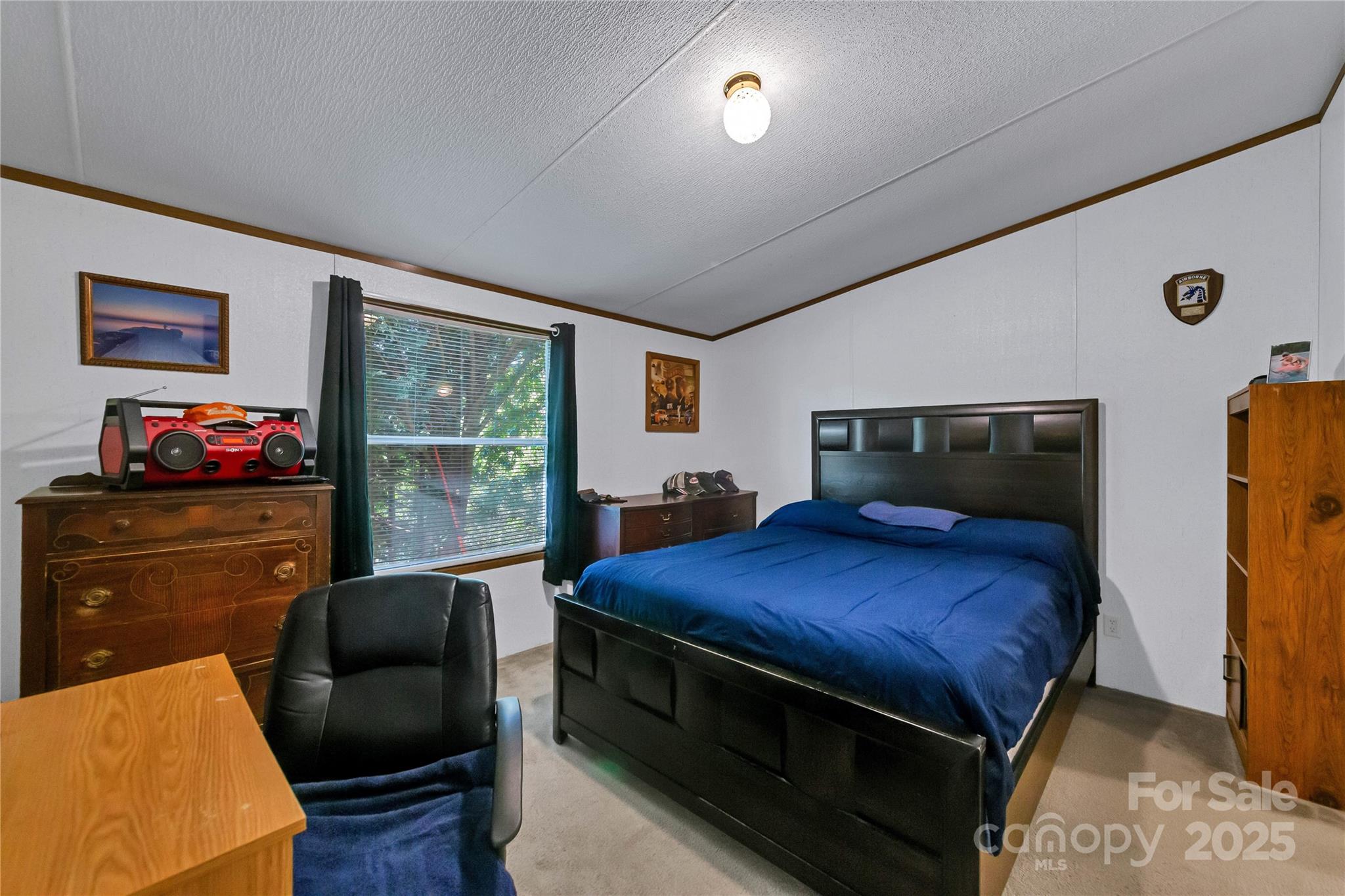 43 Goose Creek Road Swannanoa, NC 28778 - Photo 10 of 25 a bedroom with a bed and wooden floor