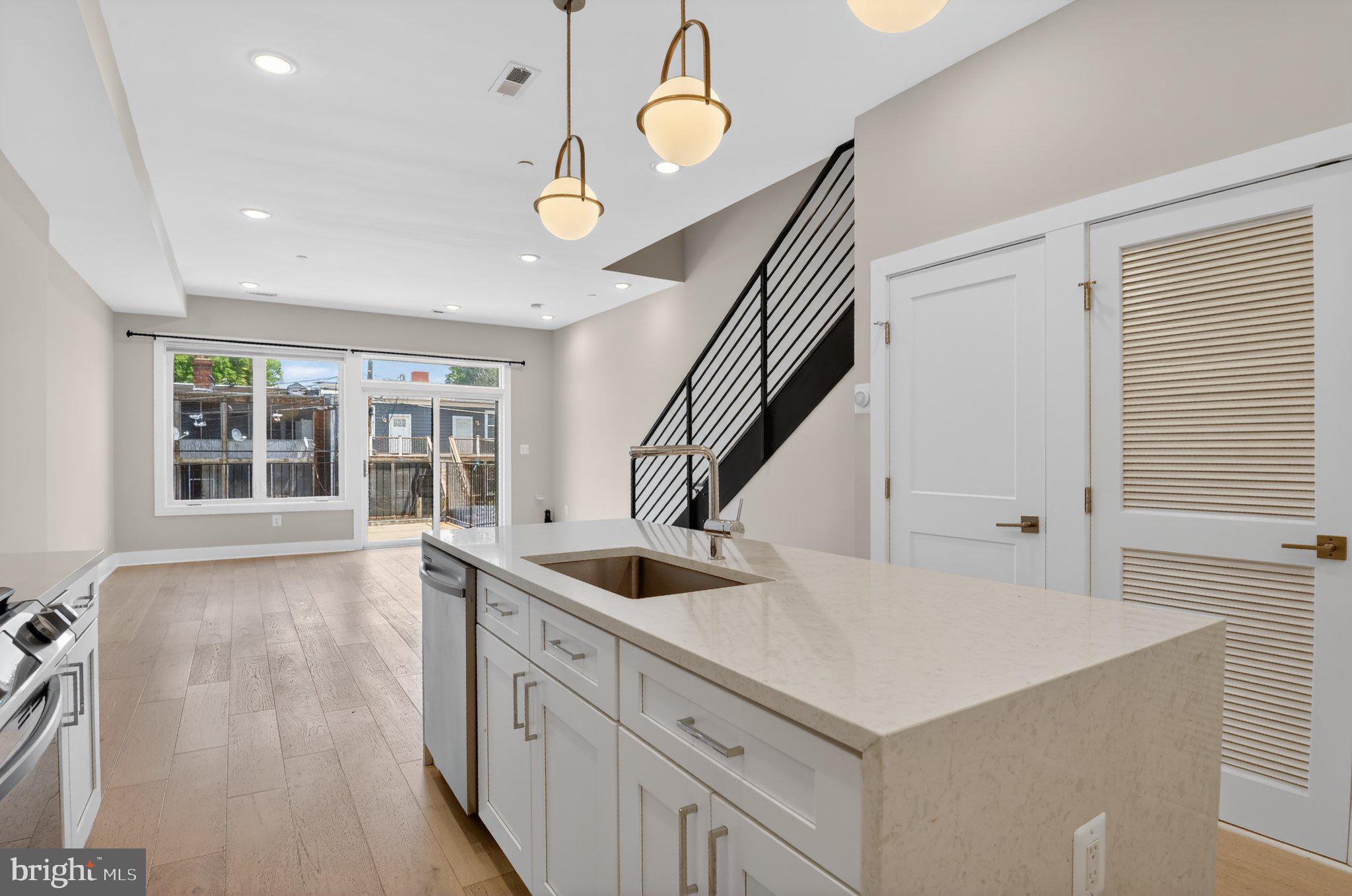 217 20th Street Northeast, Unit 2 Washington, DC 20002 - Photo 7 of 17 Modern kitchen with open layout charm.