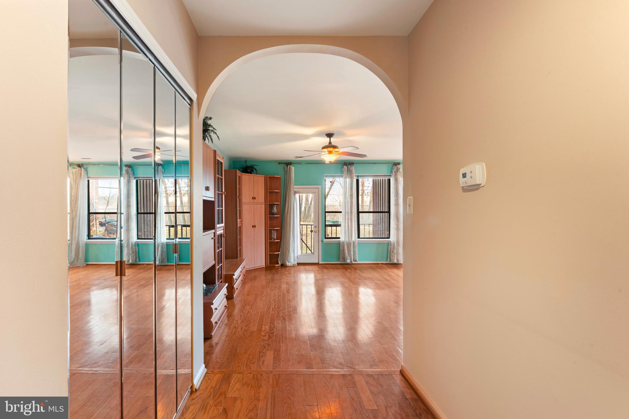 301 Byberry Road, Unit F1 Philadelphia, PA 19116 - Photo 5 of 30 wooden floor in an empty room with a window